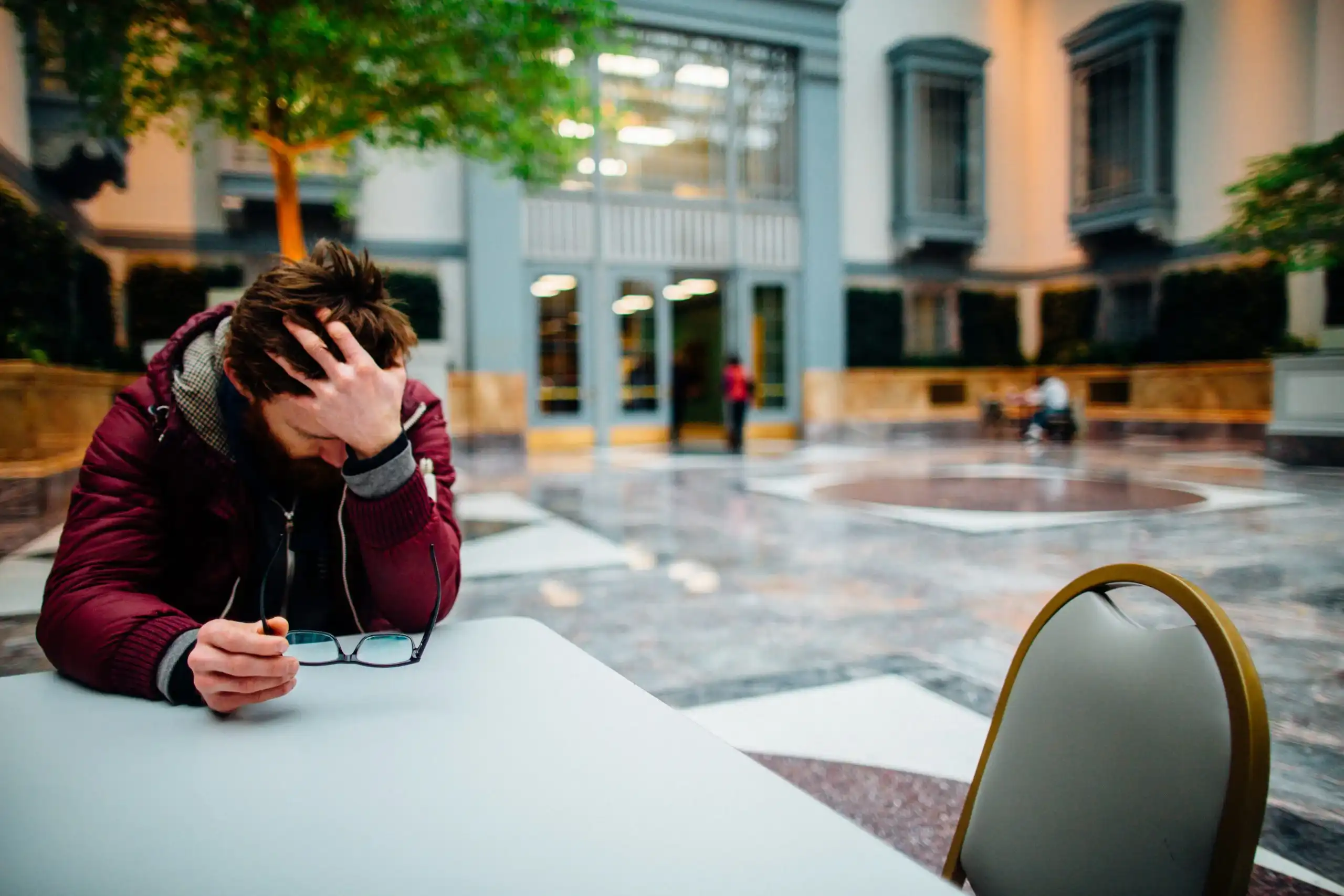 Chiropractic Anaheim CA Man Headache Food Court