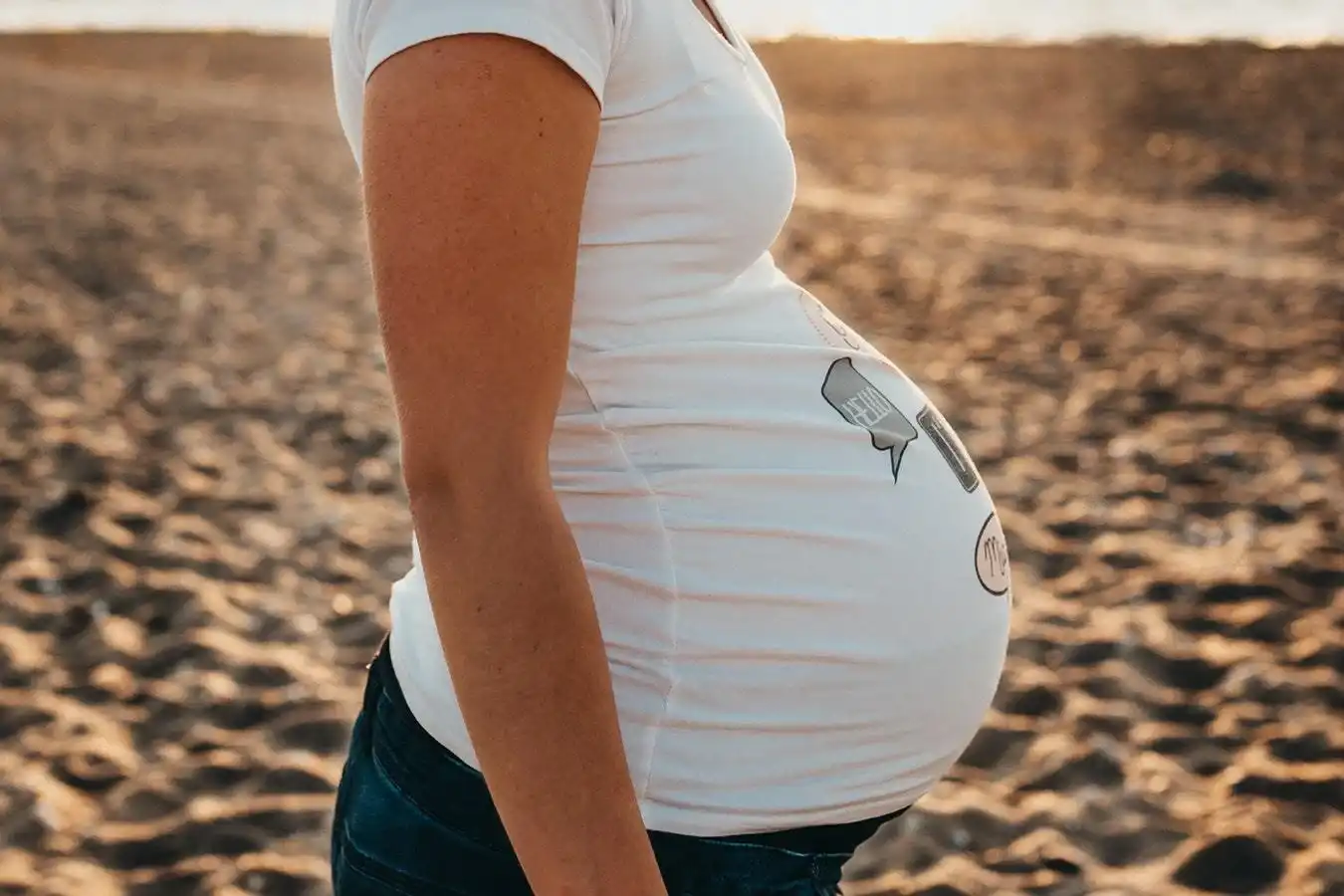 Chiropractic Anaheim CA Pregnant Woman Beach