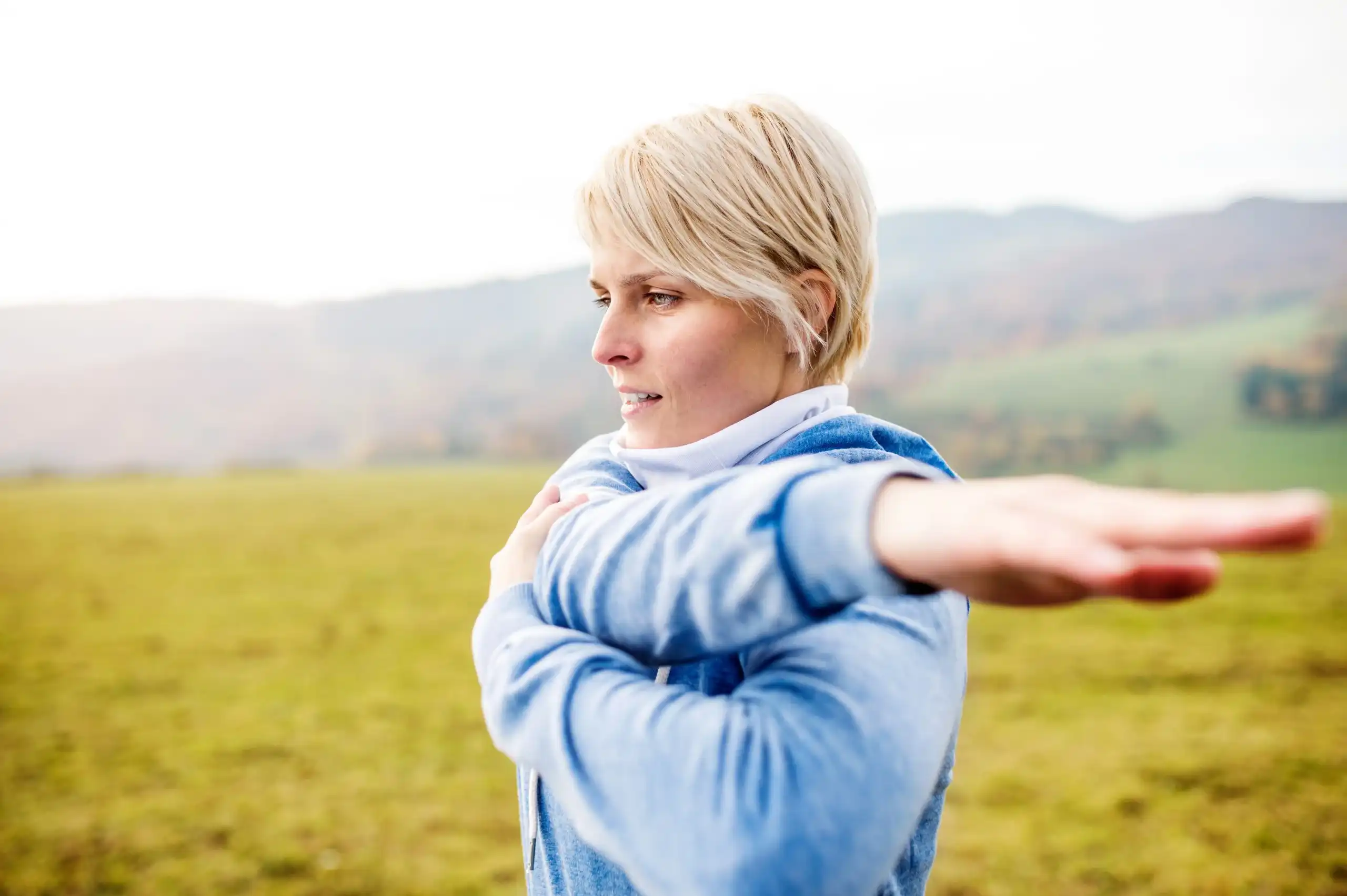 Chiropractic Anaheim CA Woman Stretching Arm Shoulders